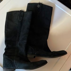 Well-loved black flat-heeled boots